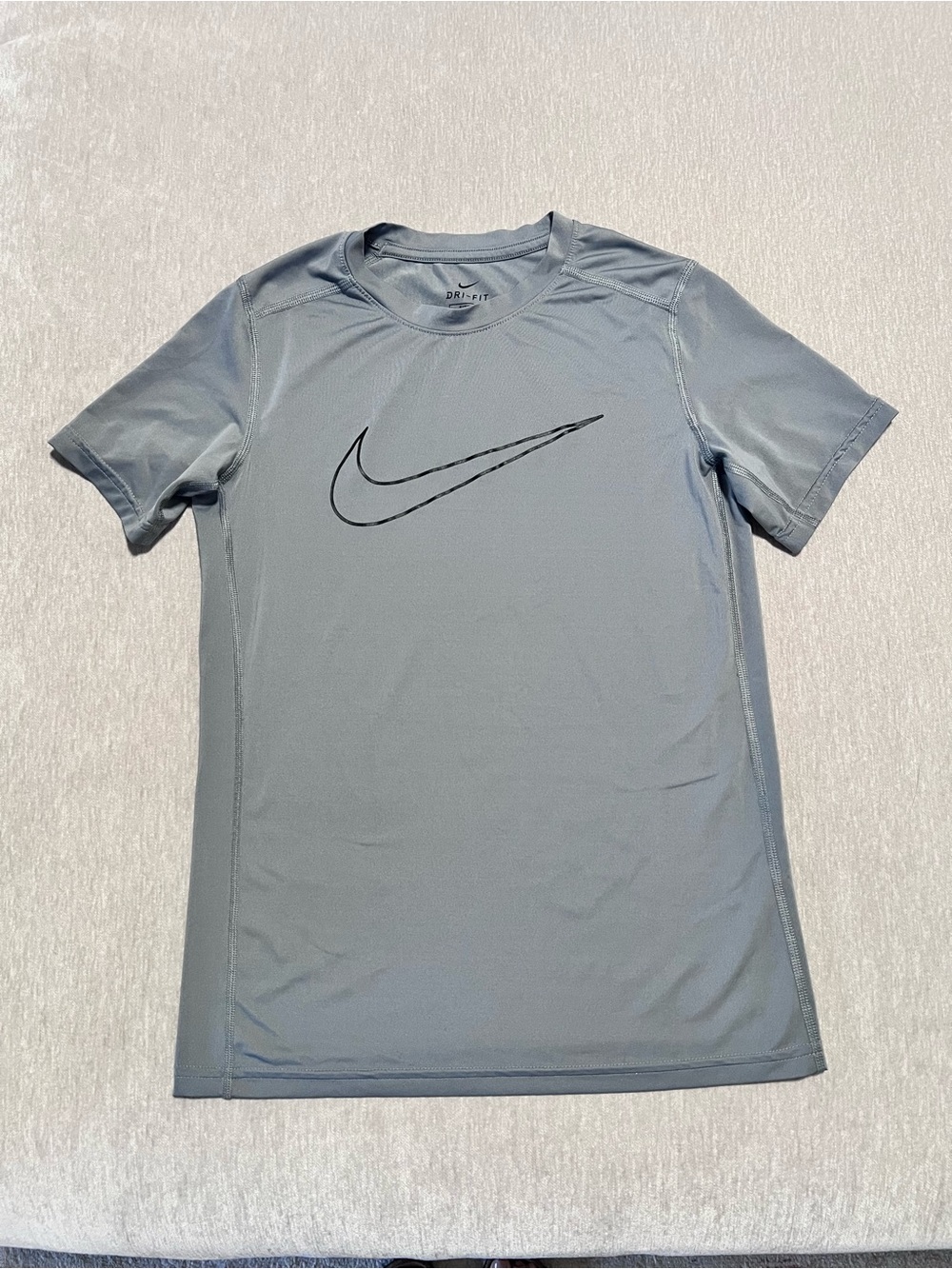 Nike Men's Light Gray Short Sleeve Dri-FIT Tee with Black Swoosh